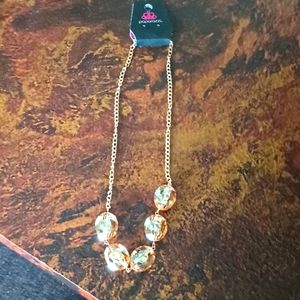 Gold colored necklace